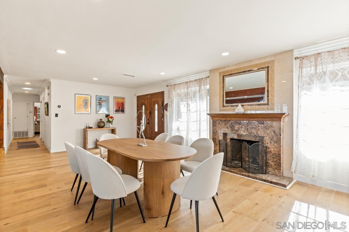 Formal dining room with marble fireplace