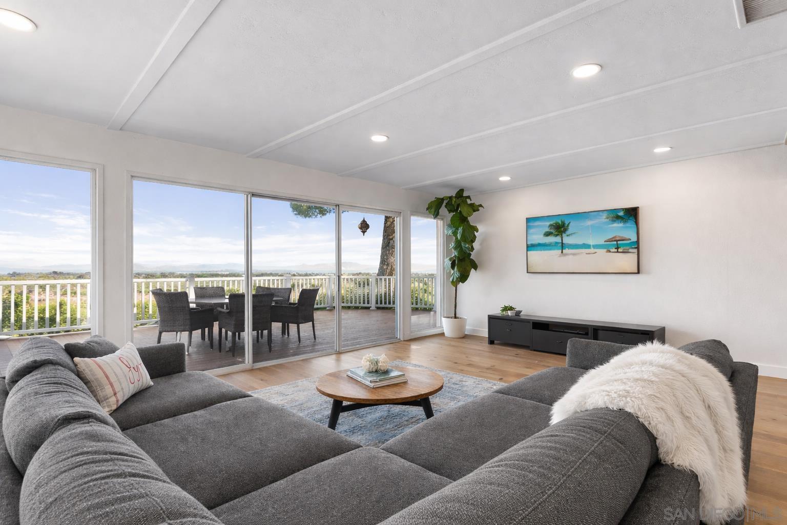 Great room with canyon views through floor-to-ceiling sliders